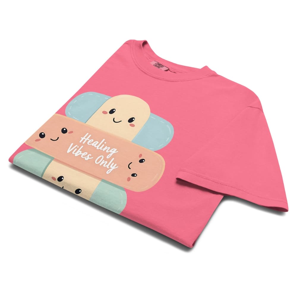 Pink sweatshirt with cartoon candy design and 'Healing Vibes Only' text on a white background