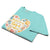 Turquoise t-shirt with a colorful graphic and text on a white background