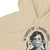 Beige hoodie with graphic of a person wearing a mask and text 'Masked Up & Saving Lives'.