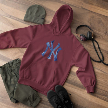 Maroon hoodie with blue logo, green beanie, black shoes, and headphones on a wooden floor.