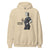 Beige hoodie with a graphic of a person holding a coffee cup and text 'Coffee first. Chart later.' on a white background.