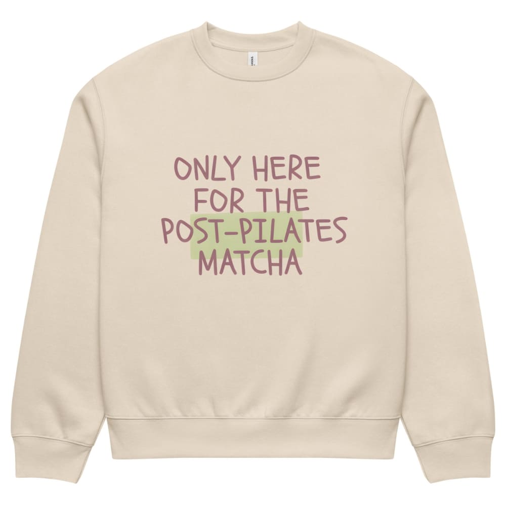 Beige sweatshirt with text 'Only here for the post-pilates matcha' on a white background
