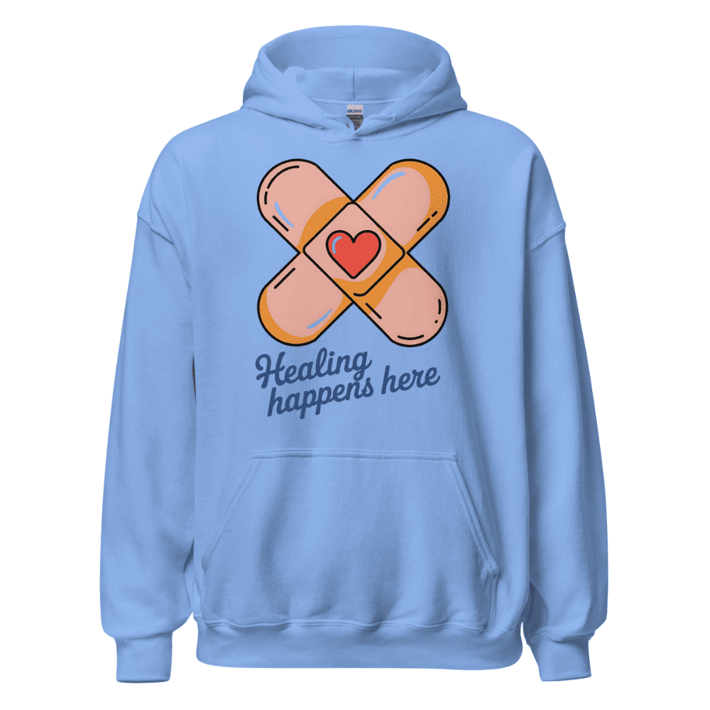 Light blue hoodie with bandage design and 'Healing happens here' text on a white background