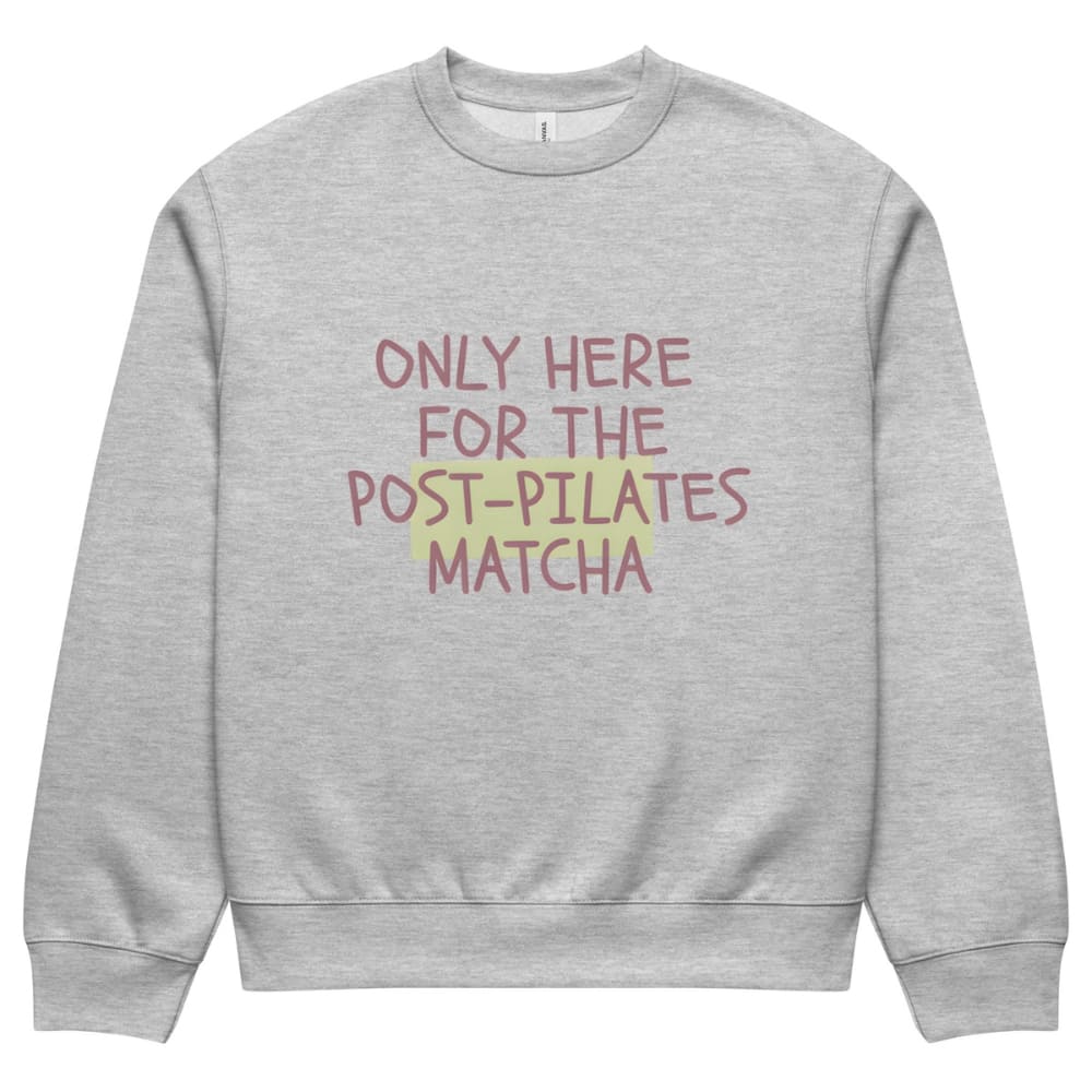Gray sweatshirt with text 'Only here for the post-pilates matcha' on a white background