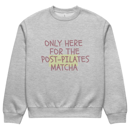 Gray sweatshirt with text 'Only here for the post-pilates matcha' on a white background