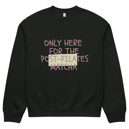 Black sweatshirt with text 'Only here for the post-pilates matcha' on a white background