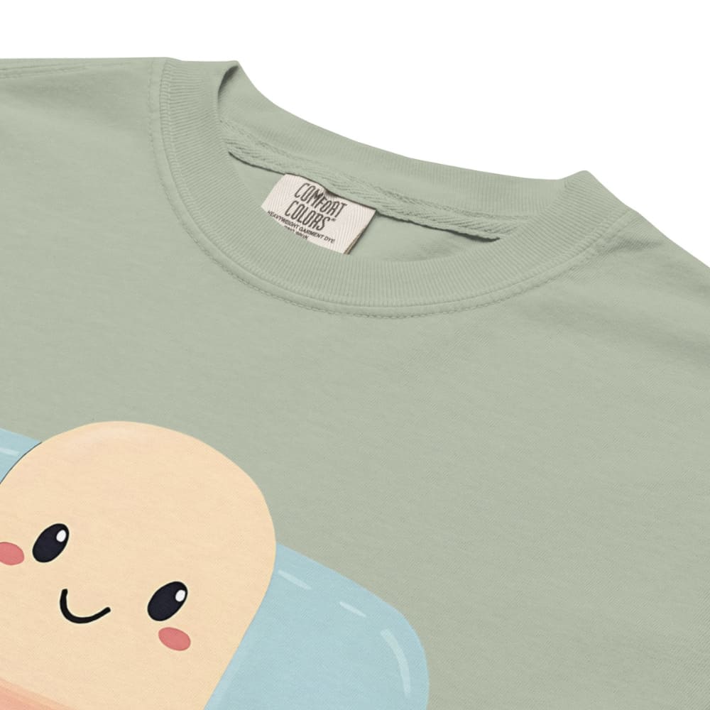 Light green t-shirt with a cartoon character design on a white background