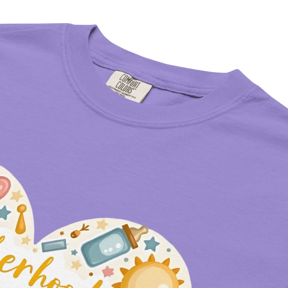 Purple shirt with a colorful graphic design and 'Comfort Colors' label.
