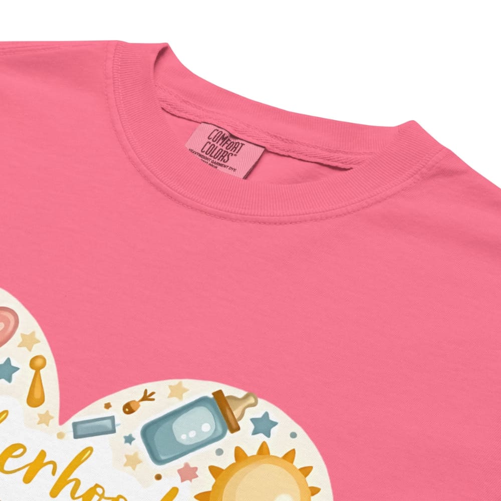 Pink t-shirt with a baby-themed graphic and 'Comfort Colors' tag.
