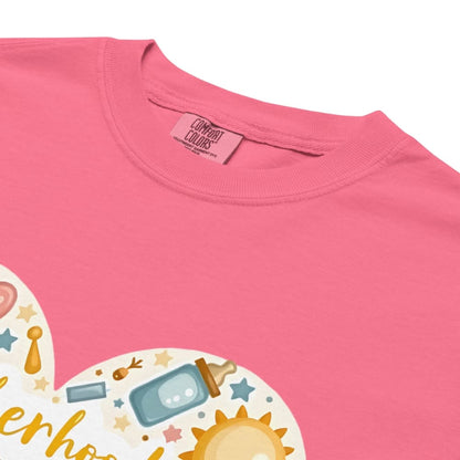 Pink t-shirt with a baby-themed graphic and 'Comfort Colors' tag.