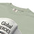 Light green t-shirt with 'Global Heroes' text and Comfort Colors label.