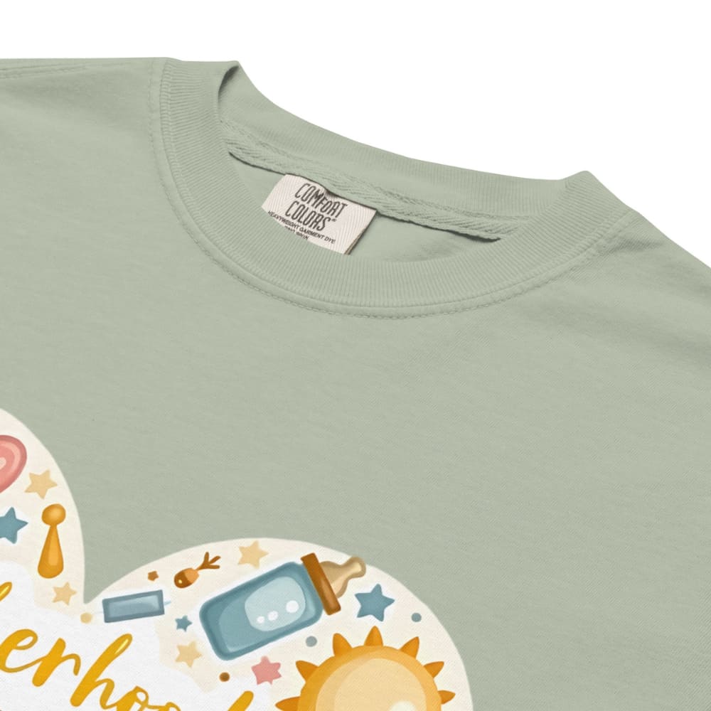 Light green t-shirt with baby-themed design and 'Comfort Colors' label.