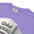 Purple t-shirt with 'Global Heroes' text and a white sneaker on a white background