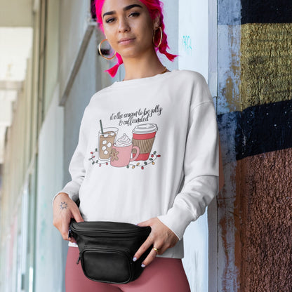 Person wearing a white sweatshirt with coffee-themed design, holding a black fanny pack.