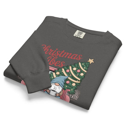 Folded gray sweatshirt with Christmas design and text on a white background