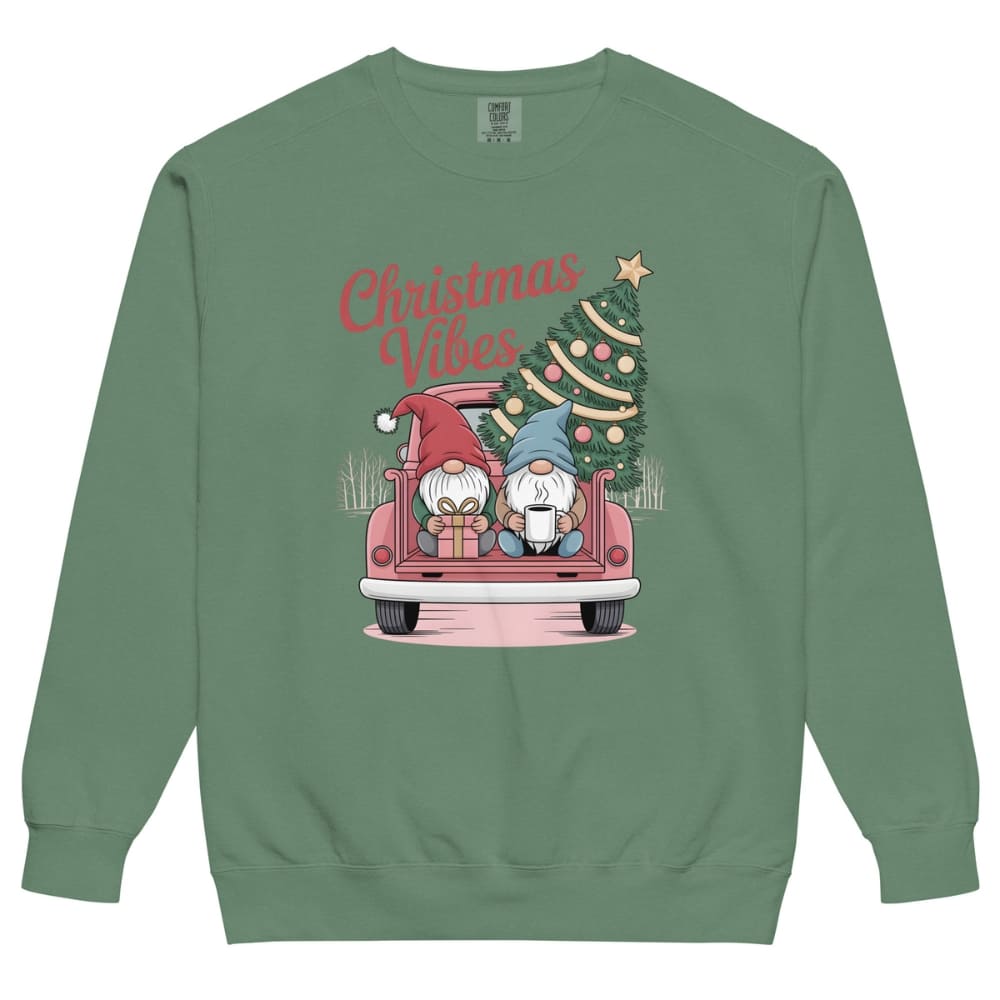 Green sweatshirt with Christmas-themed design featuring gnomes and a tree on a white background