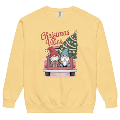 Yellow sweatshirt with Christmas-themed design featuring gnomes and a tree on a white background