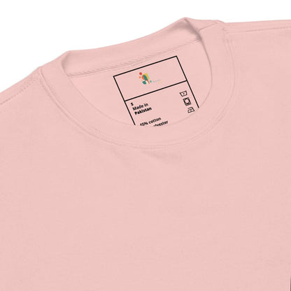 Close-up of a pink garment with a label on a white background