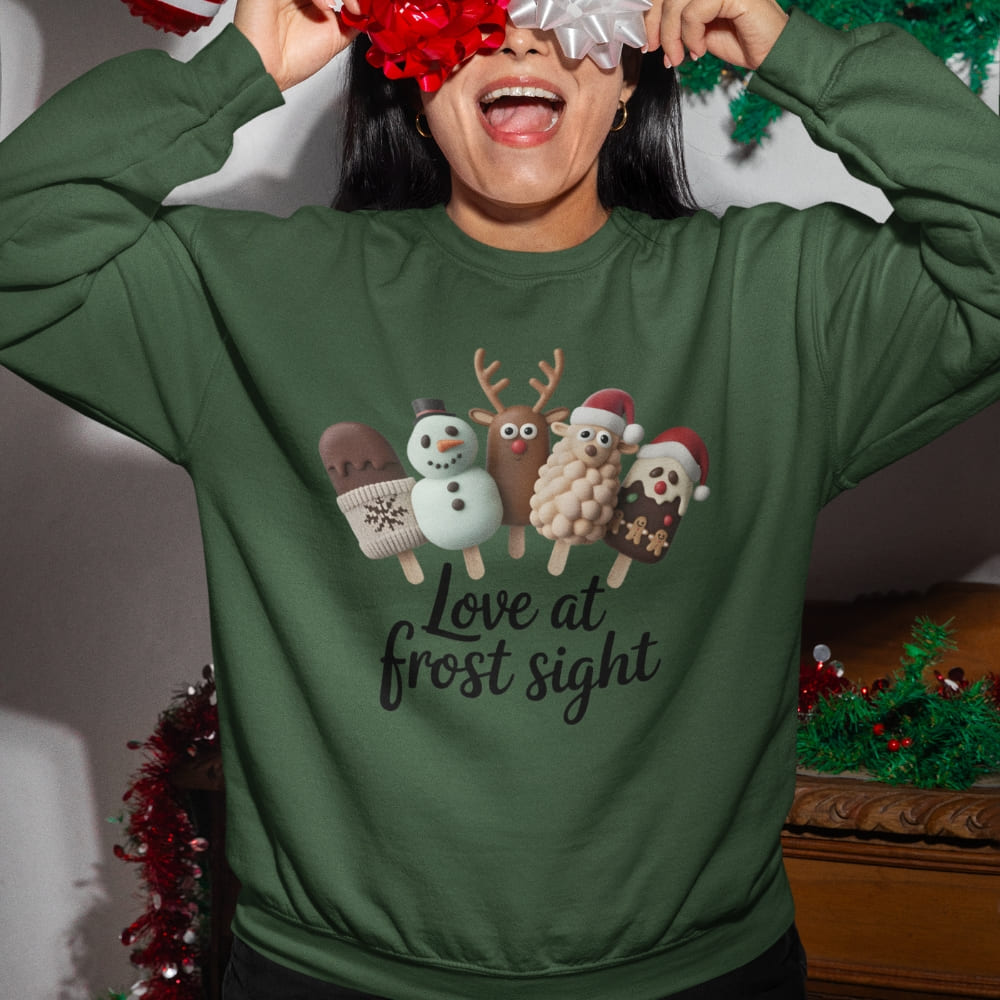 Person wearing a green Christmas-themed sweatshirt with festive graphics and text.