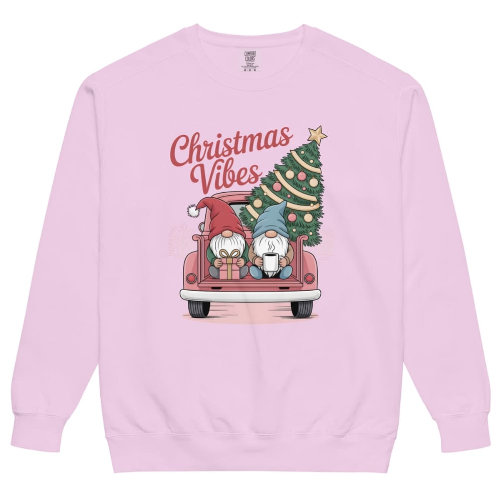 Pink sweatshirt with Christmas-themed design featuring gnomes and a tree on a white background