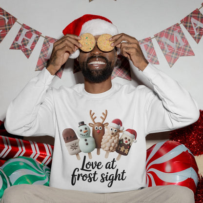 Man wearing a Christmas-themed shirt with cookies and festive decorations in the background