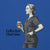 Illustration of a person holding a coffee cup with 'Coffee first. Chart later.' text on a blue background