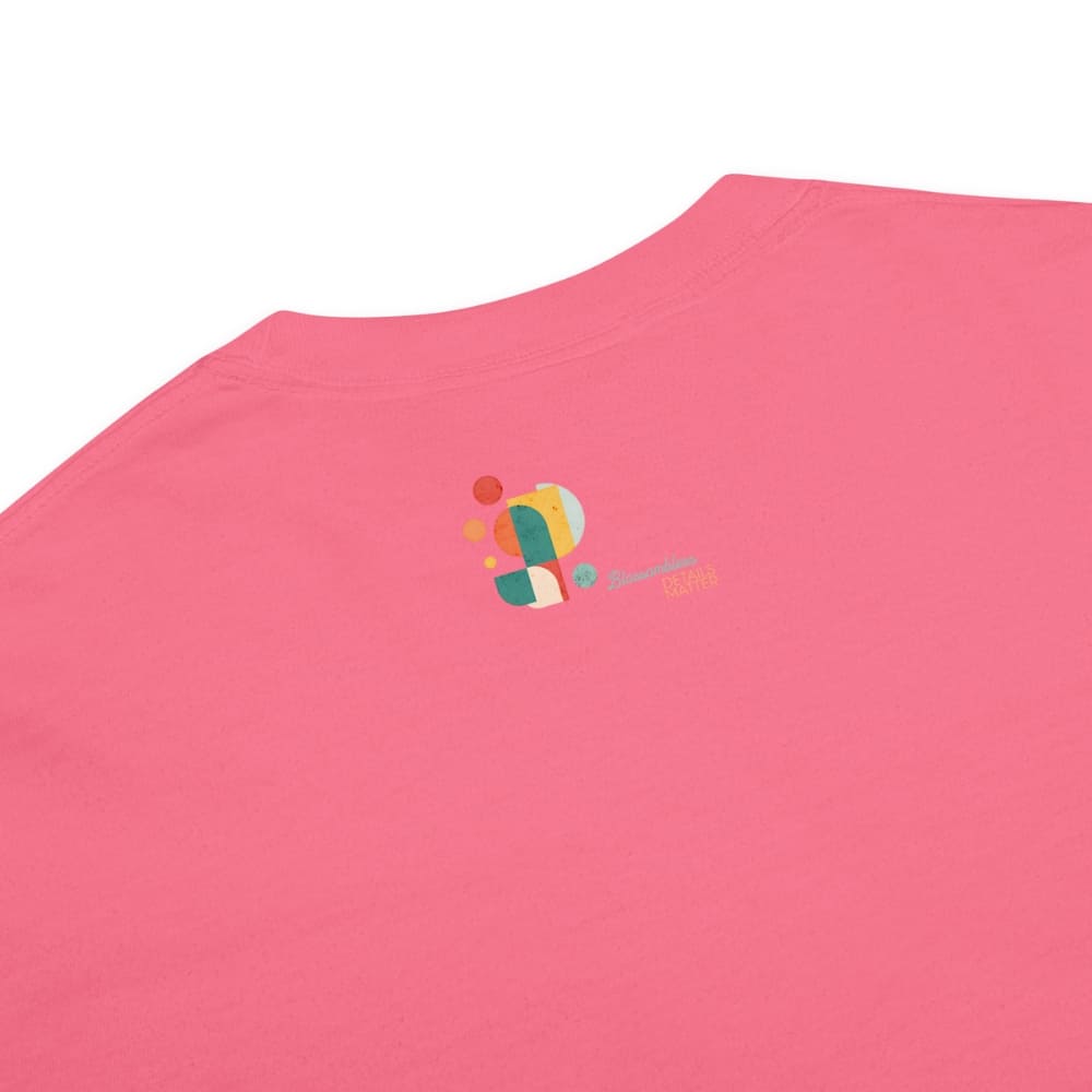 Pink t-shirt with a colorful embroidered design on a white background