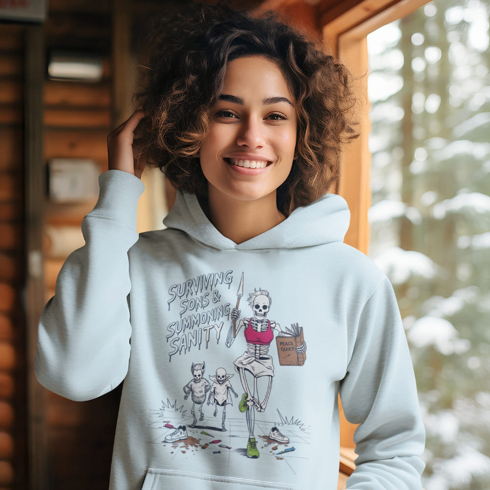 Person wearing a hoodie with a graphic design in a snowy outdoor setting