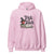 Pink hoodie with 'Trick or Teach' design featuring a witch hat, books, and an apple on a white background.