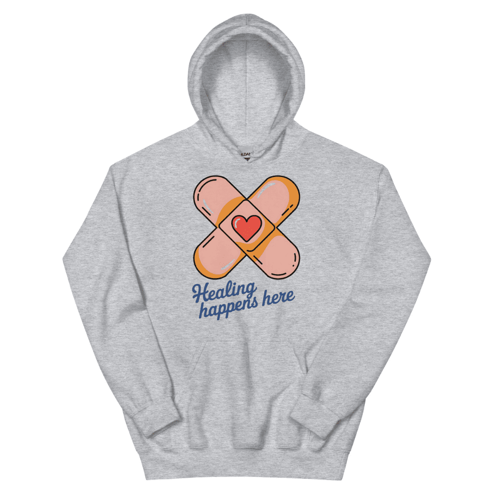 Gray hoodie with bandage design and 'Healing happens here' text on a white background