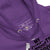 Close-up of a purple hoodie with visible label details