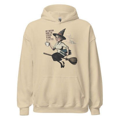 Beige hoodie with a graphic of a witch on a broom and text on a white background