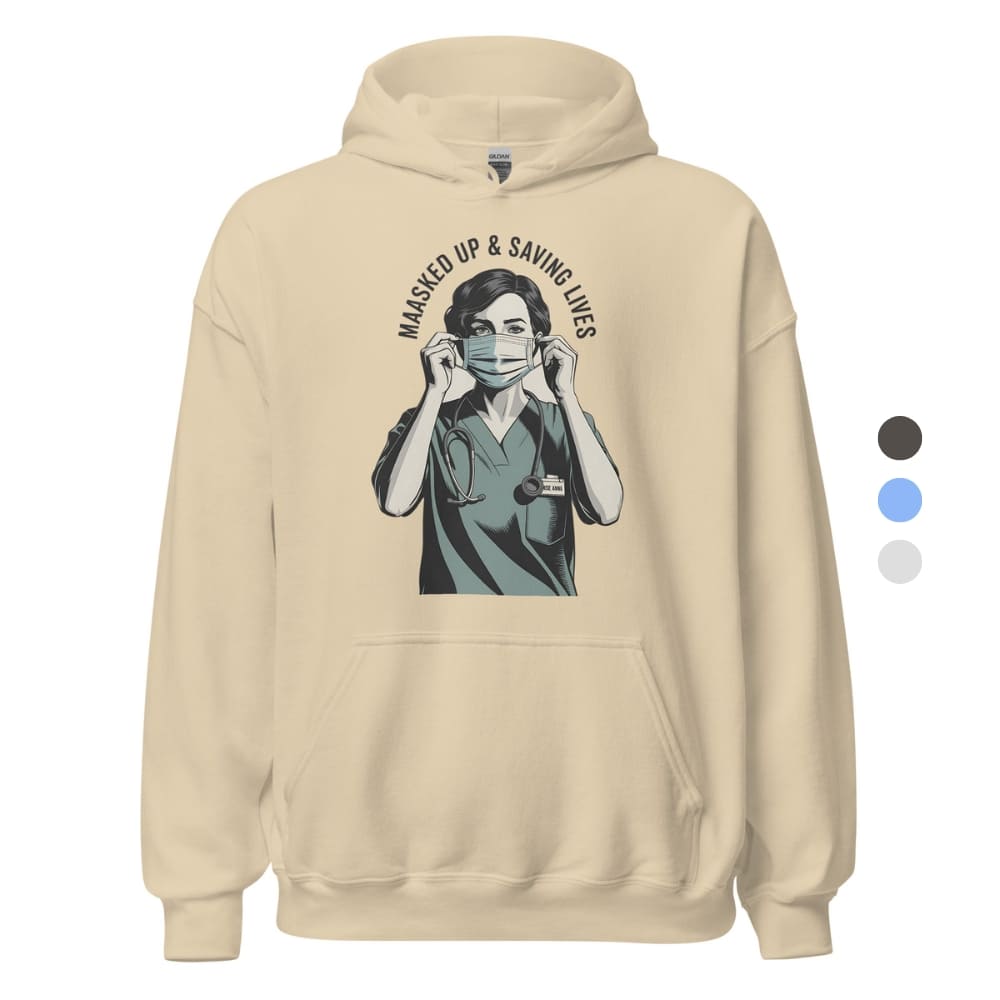 Beige hoodie with graphic of a person wearing a face mask and text 'Masked Up & Saving Lives' on a white background.