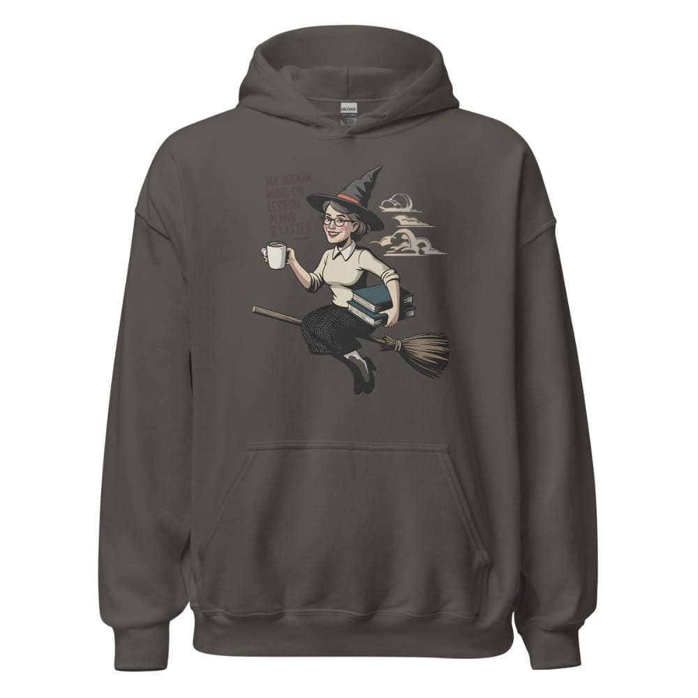 Dark gray hoodie with a graphic of a witch on a broom holding a coffee cup on a white background