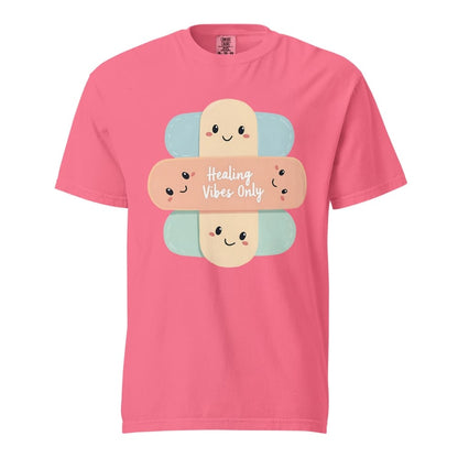 Pink t-shirt with cartoon bandages and 'Healing Vibes Only' text on a white background