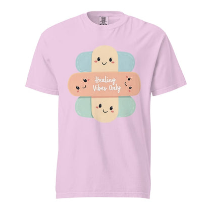 Pink t-shirt with cartoon bandages and 'Healing Vibes Only' text on a white background