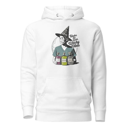 White hoodie with a graphic of a witch holding bottles and text 'Under the Influence Witchy Vibes' on a white background.