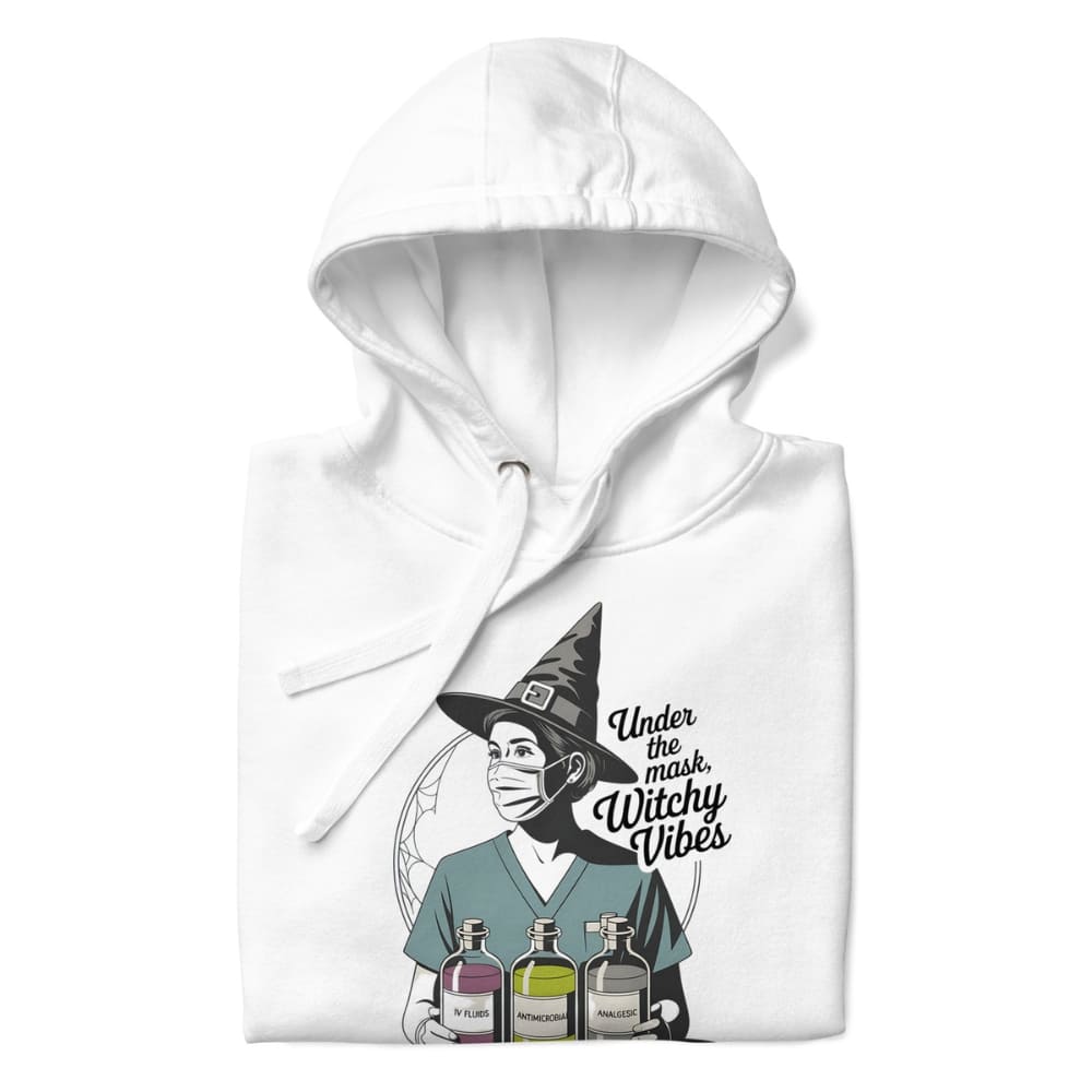 White hoodie with a graphic design of a witch wearing a mask and text 'Under the mask, Witchy Vibes' on a white background.