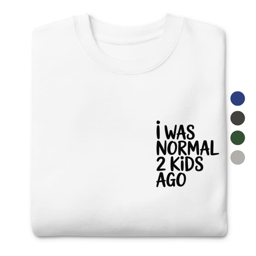 White t-shirt with 'I WAS NORMAL 2 KIDS AGO' text on a white background
