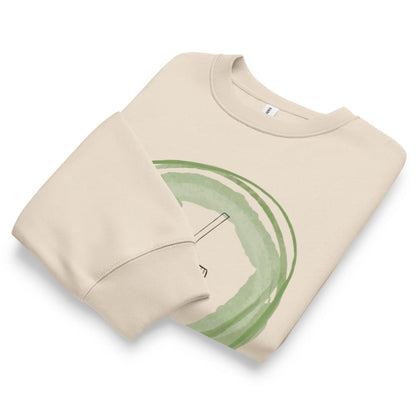 Beige sweatshirt with green abstract design on a white background