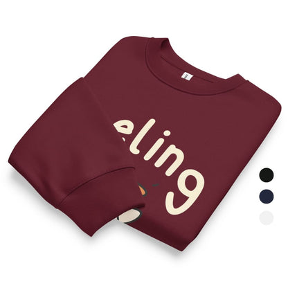 Folded maroon sweatshirt with 'ling' printed on it against a white background