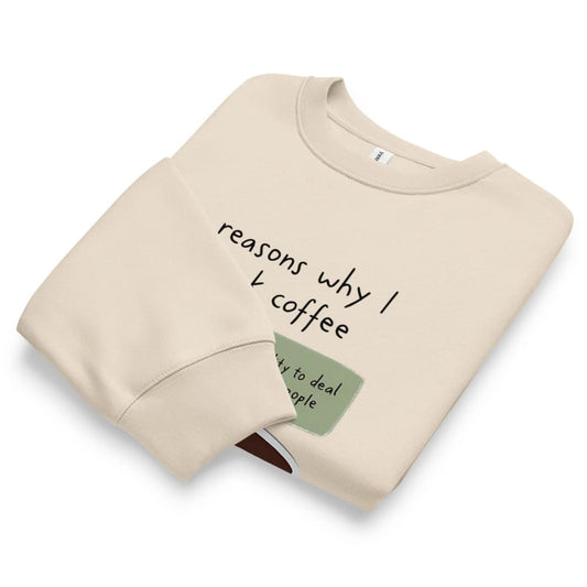 Folded beige sweatshirt with text on a white background
