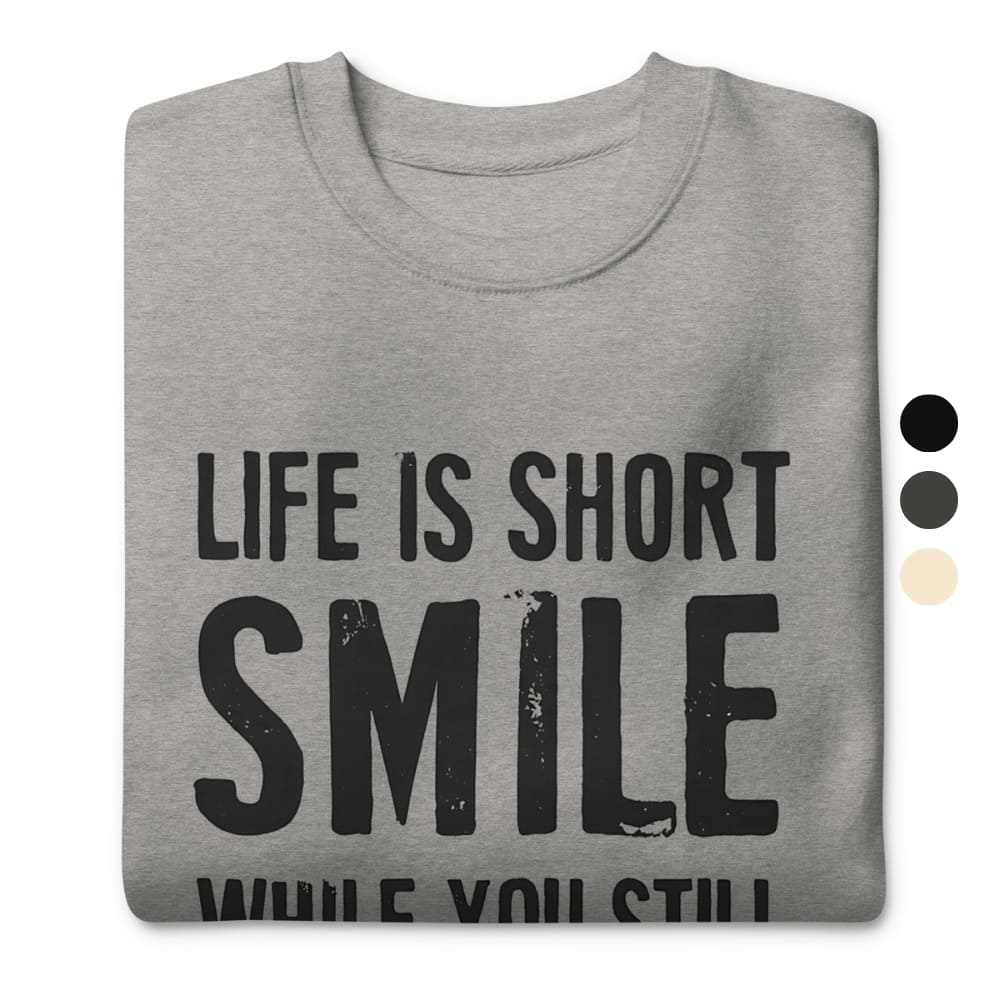 Gray sweatshirt with 'Life is short, smile while you still can' text on a white background