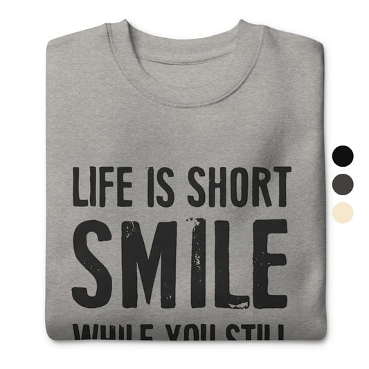 Gray sweatshirt with 'Life is short, smile while you still can' text on a white background
