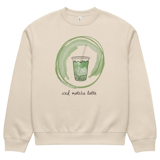 Beige sweatshirt with a green graphic of an iced matcha latte and text on a white background