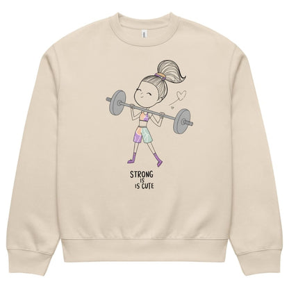 Beige sweatshirt with a graphic of a girl lifting weights and 'Strong is Cute' text on a white background