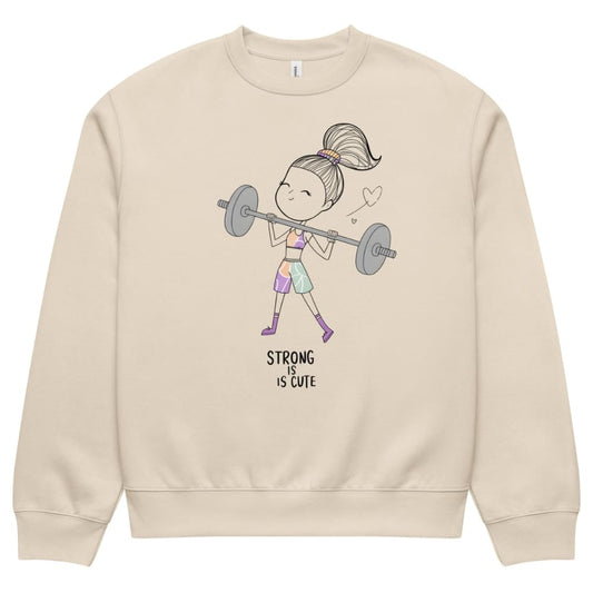 Beige sweatshirt with a graphic of a girl lifting weights and 'Strong is Cute' text on a white background