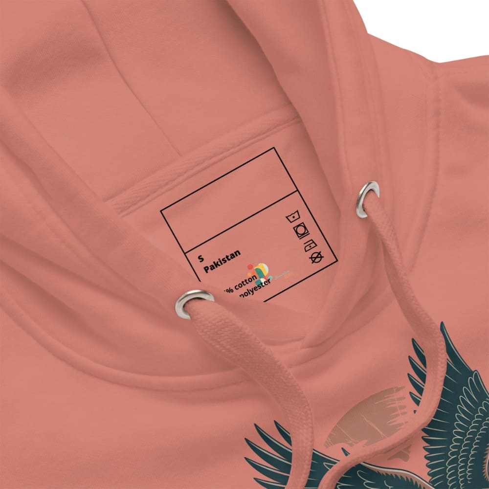 Close-up of a pink hoodie with a label and bird design.