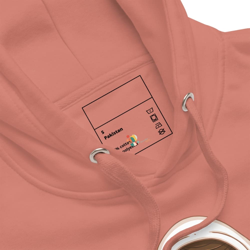 Close-up of a pink hoodie with a label on the chest pocket.