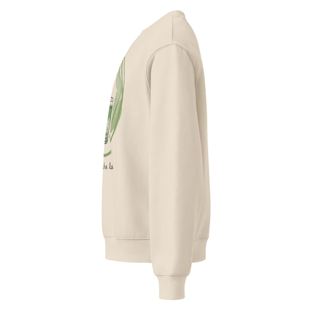 Beige hoodie with a graphic design on the sleeve against a white background